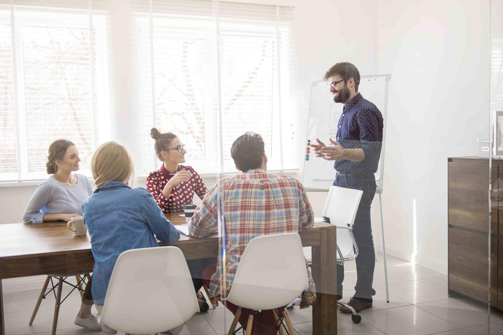 executive-presenting-strategy-of-work-min